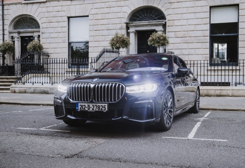 Black BMW 745Le parked outside a Georgian building in Dublin